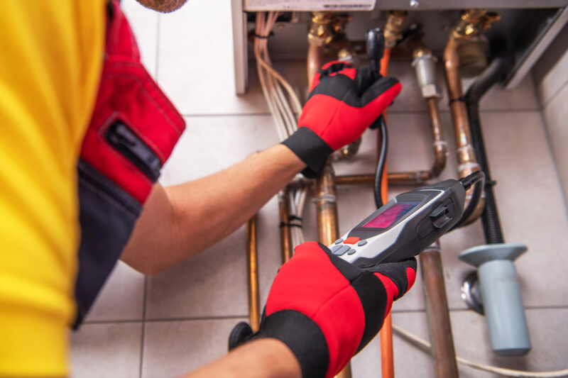 VAEZR Studio | Field training experience showing an energy and utility technician using diagnostic equipment to inspect pipes and mechanical systems.